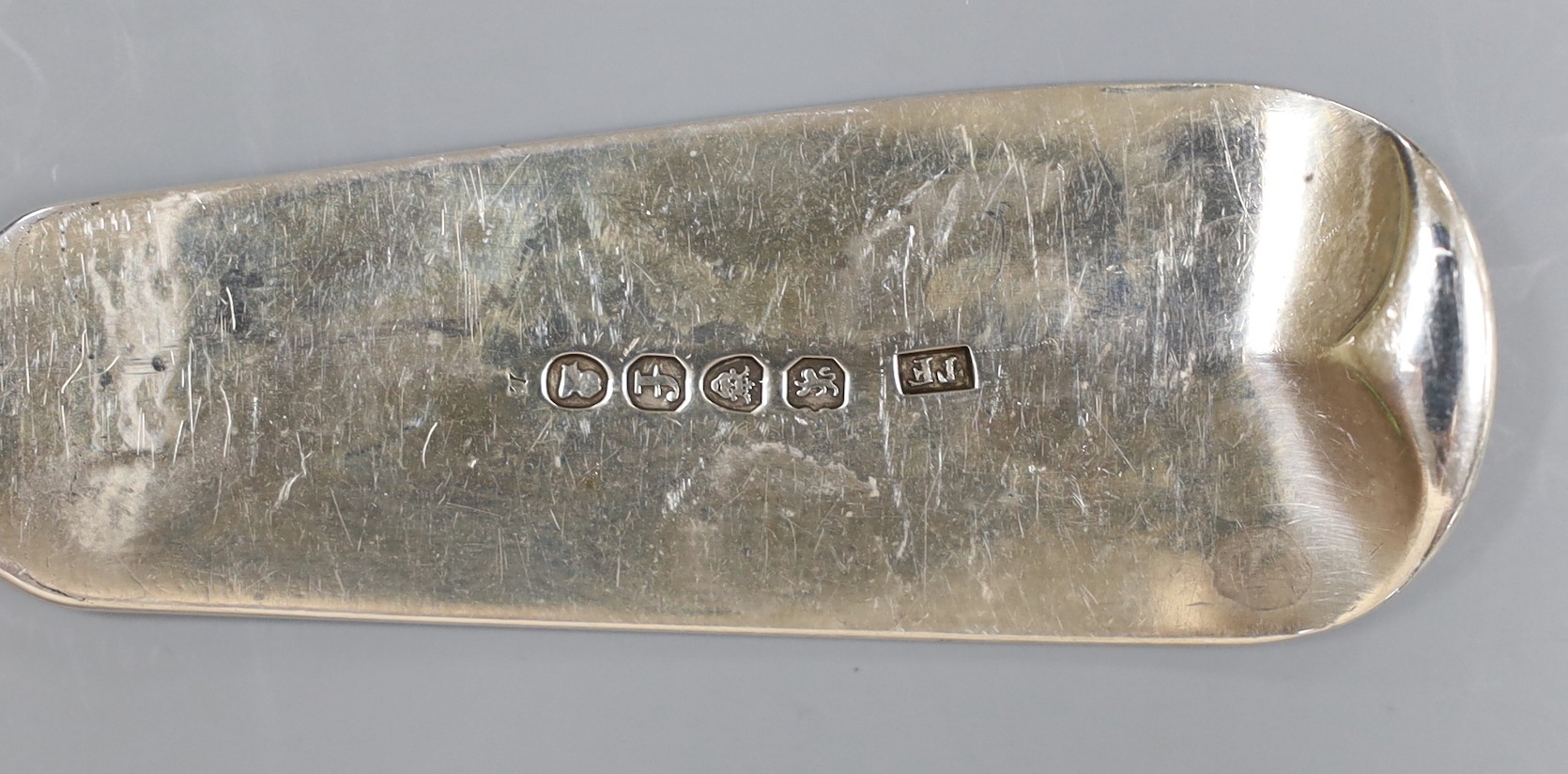 A George III silver fiddle pattern basting spoon, initialled P, London 1821, 4.5 oz.